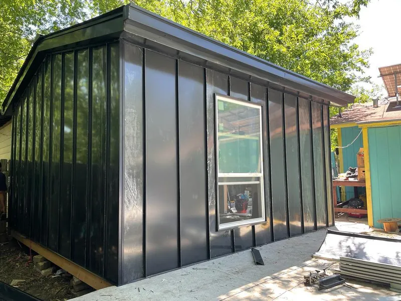 Black standing seam metal wall panels for Metal Roof Installation in Amherst